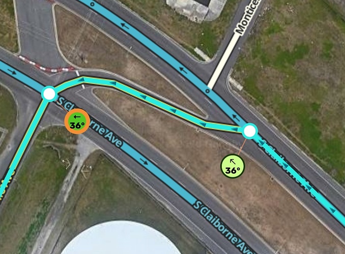 The raised grassy area separates the AGC from traffic well before the left turn motion begins
