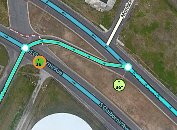 The raised grassy area separates the AGC from traffic well before the left turn motion begins