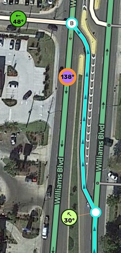 The painted gore separates the AGC from traffic well before the left turn motion begins